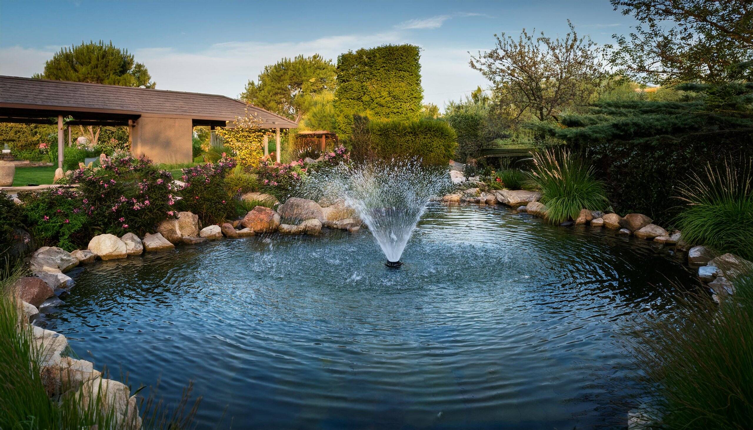 Photo of a water fountain in a garden pond